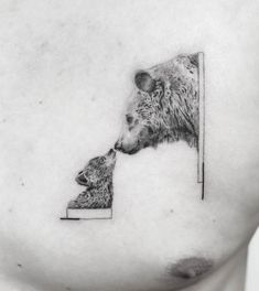 a black and white photo of two bears on the side of a woman's stomach