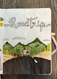 a notebook with the words roadtrip written on it and a drawing of a van