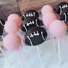 chocolate covered cake pops with pink and black frosting