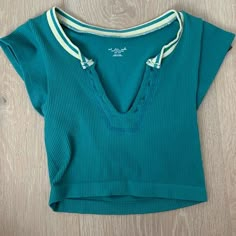 Urban Outfitters Go for Gold Top in Teal Urban Outfitters Preppy Top, Urban Go For Gold Top, Urban Outfitters Seamless Top, Urban Outfitters Top Outfit, Urban Outfitters T Shirt, Urban Outfitters Go For Gold Top, Urban Outfitters Outfit Ideas, Urban Outfitters Aesthetic