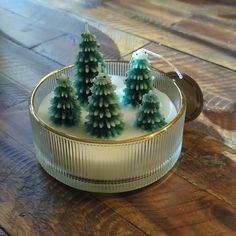 small green christmas trees in a glass dish