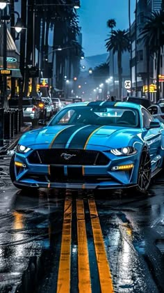 a blue sports car driving down a wet street