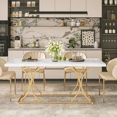 a dining room with marble table and chairs