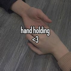 two hands holding each other with the words hand holding below them on top of it