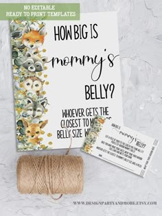 a spool of twine next to a card with the words how big is mommy's belly?