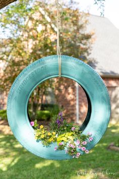 Tire planter with flowers inside Repurposed Planter, Pot Gantung, Tire Garden, Tire Planters, Mosaic Flower Pots, Water Fountains Outdoor, Garden Containers, Unique Gardens, Diy Planters