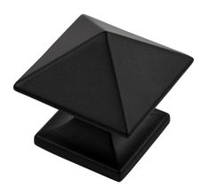 a black square and triangle shaped object on a white background