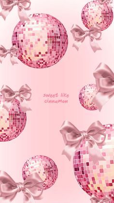 a pink background with shiny balls and bows