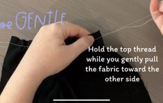 someone is threading the fabric together to make a t - shirt with words on it