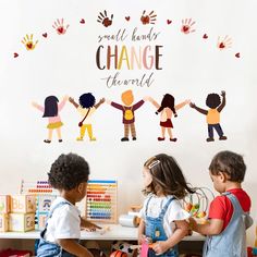 three children standing in front of a white wall with the words, small hands change there is