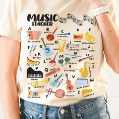 a person wearing a t - shirt with musical instruments on it