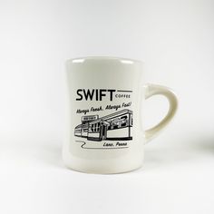 a white coffee mug with the words swift coffee on it's front and side