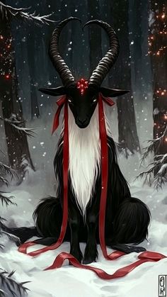 a goat with long horns sitting in the middle of a snowy forest wearing a red ribbon around its neck