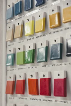 an assortment of paint samples displayed on a wall