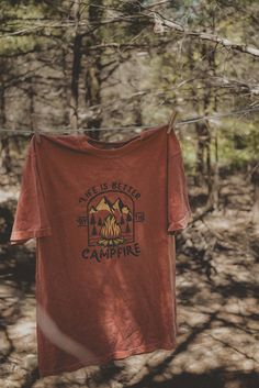 Life is better by the campfire graphic t-shirt. Each t-shirt is pressed house on a comfort colors unisex shirt. T-shirts are made of a soft cotton blend and features a vibrant direct to fabric transfer design that won't fade or crack. COLOR PICTURED: YAM Shop our wanderlust inspired t-shirt collection. Perfect for those who enjoy hiking, camping, exploring the outdoors and all adventure seeking enthusiasts. keywords: wanderlust t-shirt, adventure t-shirts, graphic tees, unisex outdoorsy shirts, Camp Clothing, Camping Tee Shirts, Rustic Clothing, Outdoorsy Shirt, Camp Aesthetic, Hiking T Shirt, Camp Shirts, Christmas T Shirt Design, Earthy Outfits