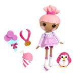 a doll with pink hair and accessories on a white background next to an owl toy