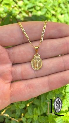 Embrace the spirit of innocence and faith with our Divino Niño Necklace. This charming piece features a delicate pendant representing the Baby Jesus, beautifully crafted to capture the essence of purity and protection. The necklace comes with a sleek Mariner Link chain, measuring 14" and 16' inches. DESCRIPTION * Material: 14K Gold Filled * Metal Purity: 14K * Chain Size: 14" and 16" Inches * Pendant: 16x10mm * Chain Thickness: 2mm * Gender: Unisex * Age Group: Baby Kids * Chain Style: Mariner L Yellow Gold Pendant Jewelry For First Communion, Baby Boy Necklace Gold, Baby Boy Necklace Cross, 14k Gold Crucifix Necklace For Baptism, 14k Gold Cross Pendant For Baptism, Girls Jewelry, Chain Styles, Newborn Baby, Favorite Things Gift