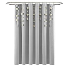 a curtain with beads hanging from it's rod, in front of a white background