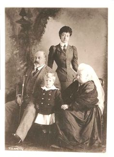 an old black and white photo of a family