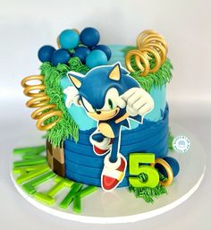 a sonic birthday cake with decorations on top