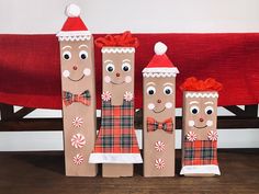 three brown paper bags decorated with christmas decorations