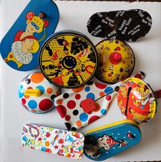 several different types of magnets on top of a white board with polka dots and clown faces