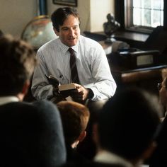 a man sitting in front of a group of people