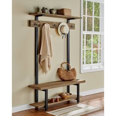 a coat rack with hooks and hats on it in front of a window next to a rug