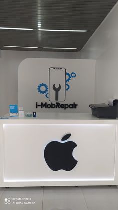 an apple store front desk with the i - mobilepair logo on it's side