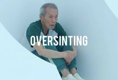 an older man sitting on top of a white wall with the words oversintting