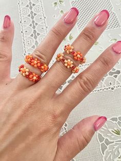 Sizing (approx.): US 5 = 50 mm US 6 = 51.8-52.5 mm US  7 = 54.3-55 mm US 8 = 56.9-57.5 mm Handmade from glass seed beads and elastic string. Knots may be visible on the underside of bracelet/ring.  If you would like to request size or color customization, please let me know through a customize note. Each item is handmade to order, therefore, returns and exchanges are not accepted but please feel free to message if there are any issues. However, I gladly accept cancellations if made within 2 hour Seed Bead Cute Ring, Seed Bead Rings Flower Tutorial, Seed Bead Bee Ring, Seed Bead Crafts Rings, Glass Beads Ring, Cheap Beaded Flower Rings, Seed Bead Fruit Rings, Daisy Beaded Rings, Beaded Daisy Rings