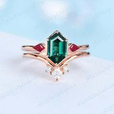 Emerald Ruby Wedding Ring Set, Art Deco Emerald Engagement Ring, Bridal Set, Unique Curve Wedding Band ❈Item detail❈ ✼Engagement ring: -Main stone: 5x9mm Long Hexagon cut Lab created Emerald -Side stones: Kite Cut 0.22ct Lab created Ruby -Material:925 sterling silver/ white gold plated/ rose gold plated / yellow gold plated / 10K/14K/18K solid gold available ✼Wedding band: -Stones: Princess & Round cut 0.15ctw Moissanite stones -Material:925 sterling silver/ white gold plated/ rose gold plated / Emerald Crystal Ring With Accent Stones For Wedding, Emerald Crystal Wedding Ring With Accent Stones, Emerald Marquise Cut Diamond Wedding Ring, Marquise Cut Emerald Diamond Wedding Ring, Art Deco Emerald Wedding Ring, Emerald-cut Diamond Ring For Wedding, Emerald Crystal Wedding Ring Round Cut, Emerald-cut Diamond Wedding Ring, Art Deco Emerald Cut Emerald Ring For Wedding