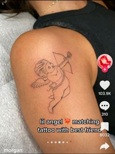 the back of a woman's arm with an angel tattoo on it