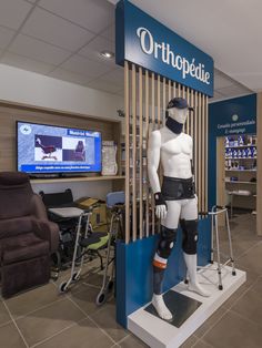 a mannequin is standing in front of the orthopedic store display