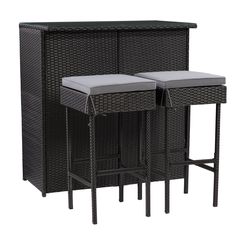 three black wicker bar stools with white cushions