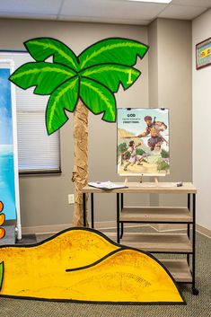 an office with a fake palm tree on the floor