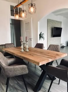 a wooden table with chairs around it