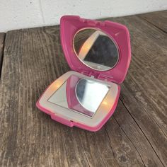 Vintage light-up compact mirror. Bright Pink Plastic with double mirror inside. Lights up when opened, and uses two miniature Christmas string light bulbs.  Good condition.  Measurements: Double Mirror, Antique Drawers, Bulb String Lights, Christmas String Lights, Pink Doll, Square Mirror, Pink Plastic, Hand Mirror, Pocket Mirror