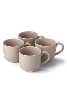 four coffee cups sitting on top of each other