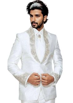 Golden work designer high neck 2 Button tuxedo suit- 5pc (Jacket, Pants, Shirt, Tie, Brooch) made from cream color pure polyester fabric. It has bottom as trouser. Hand embroidered as shown. It has bottom as trouser.  Perfect for weddings,graduation ceremoney,dating, meeting, yacht party, banquet, hosts' wearing,etc High Quality, 100% Poly, Fully Lined, Made For Year-Round Use Dry clean only; Made in India Elegant Beige Unstitched Suit For Wedding, Elegant Beige Unstitched Suit For Formal Occasions, Elegant Cream Unstitched Suit For Wedding, Elegant Fitted Nehru Jacket For Groom, Elegant Tailored Sherwani For Wedding, Tailored Elegant Bandhgala For Wedding, Elegant Tailored Bandhgala For Wedding, Tailored Sherwani For Wedding, Fitted White Sherwani For Groom