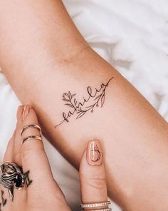 a woman's legs with a tattoo on her left leg and the word love written in cursive writing