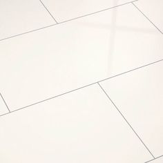 a black and white cat laying on the floor