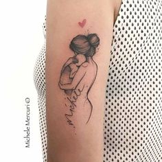 a woman's arm with a tattoo on it and a heart in the background