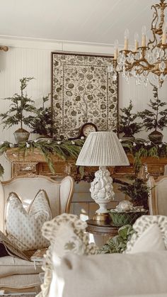 a living room filled with furniture and a chandelier