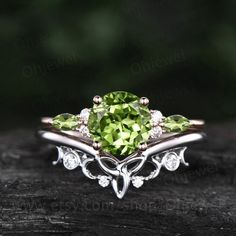 "This is a natural peridot engagement ring in solid gold,about 7mm 1.3ct round cut.  The accent stones are round moissanites and marquise cut 2x4mm peridot. The matching band stones are round  moissanites. The band width about 1.3-1.4mm. It can be made in any ring size. However please contact me to custom make it to a special big or small size. It can be made in white gold,rose gold or yellow gold with 14k or 18k. However for some people who are nickel allergic,I can also make it to 925 sterling silver to make you can wear it. The ring is handmade,very high quality! 30 days money back guarantee. Returns & Warranty 30-Day money back guarantee (starting from the day of delivery). \"Made to Order\" purchases qualify for our 30-day money back guarantee. The 30-day money back guarantee gives yo Victorian Peridot Ring, Elegant Peridot Jewelry With Prong Setting, Wedding Jewelry With Peridot In Halo Setting, Elegant Peridot Promise Ring, Elegant Peridot Diamond Ring With Prong Setting, Elegant Peridot Round Cut Diamond Ring, Wedding Jewelry With Prong Set Peridot, Wedding Jewelry With Prong Setting And Peridot, Elegant Round Cut Peridot Diamond Ring