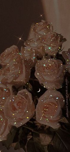 a bouquet of white roses sitting on top of a table