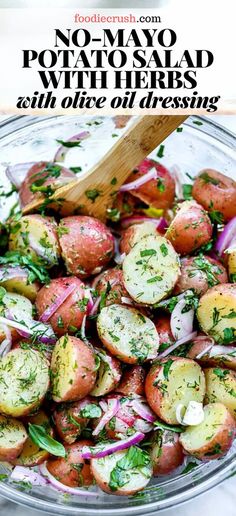 a glass bowl filled with potatoes and onions