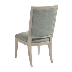 the back side of a dining chair with grey upholstered seat