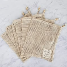 four pieces of cloth sitting on top of a white counter