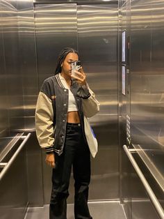 elevator mirror selfie outfit tote bag braids varsity jacket Crop Top Cargo Pants, Elevator Mirror Selfie, Elevator Mirror, Top Cargo Pants, Black Cargo Pants Outfit, Mirror Selfie Outfit, Elevator Selfie, Varsity Jacket Outfit, Cargo Pants Outfit